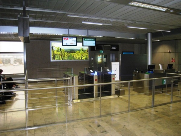FIGURE 5A The gate layout recommended, with two electronic gates and one manual gate. An overview showing the gates together with the queueing zone (foreground) and the pre-boarding area (background)
