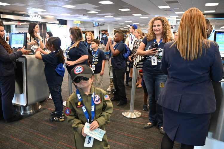 MIAair tour participants prepare to board an American Airlines aircraft.