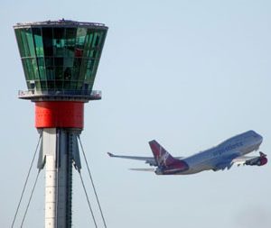 Air traffic control tower and aeroplane