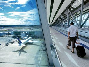 Passenger travelling to boarding gate at London Gatwick Airport