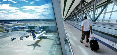 Passenger travelling to boarding gate at London Gatwick Airport