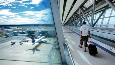 Passenger travelling to boarding gate at London Gatwick Airport