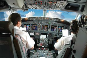 Airline pilots in airplane cockpit