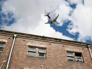 Plane over house