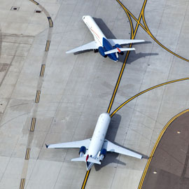 Planes taxiing on runway