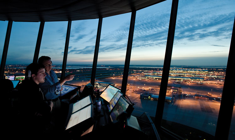 Air traffic control tower at night