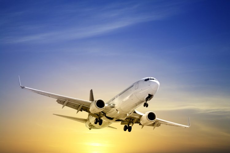 Boeing 737 landing at sunset