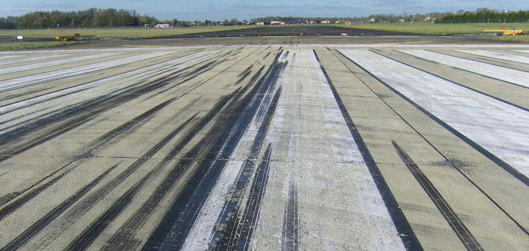 Rubber deposits on runway thresholds due to landing aircraft