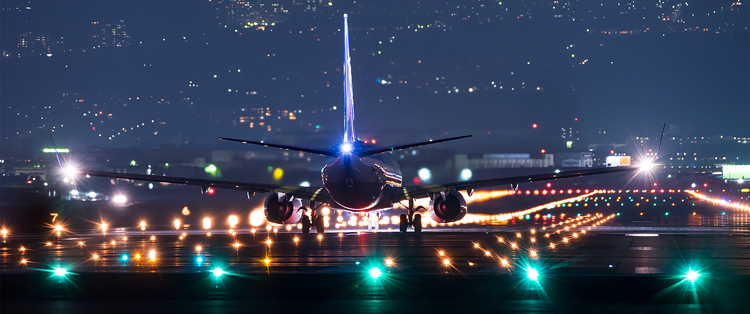 Runway lighting illuminates aircraft preparing for take off