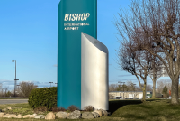 While major hub airports often dominate the spotlight, it’s regional airports like Flint Bishop International Airport (FNT) in southeast Michigan that are quietly redefining resilience and innovation. From pandemic-era pivots to international expansion goals, Sapone shares what it means to lead with purpose at a mid-sized airport, and why being small might just be Flint’s greatest strength. “It takes partnership with the community and regional partners to really make the airport thrive.” That is the philosophy that guides Nino Sapone as he leads Flint Bishop through a critical growth period. “Even though an airport like Flint has been there for a long time,” Sapone stated, “people really didn’t realise the service was there as we’re overshadowed by some bigger airports, like Detroit Metro. So, it’s like a hidden jewel.” Terminal transformation: rooted in local identity A key project in 2025 is the complete overhaul of Flint Bishop’s terminal, supported by a nearly $2 million FAA grant. “Most of that money is going toward the second phase of our airside terminal project,” Sapone explained. “It’s going to have all new ticketing counters and an all-new building.” But this isn’t just about bricks and mortar. “For the first time, we’re going to put in terrazzo flooring in Flint, and it’s going to be focused on the Flint demographics,” he added. “Downtown Flint’s famous buildings will literally be embedded in the floor. We want it to be a sense of place for the community.” Passenger experience and digital upgrades The passenger experience is getting a tech boost, too. “We’re redoing all our flight information display systems,” said Sapone. “There’ll be large, new monitors and an interactive screen at the entrance — you can ask questions, and it’ll react with you. That’s going to make the customer experience a lot better.” Outdated internal systems are also being overhauled to support more efficient operations — and more revenue. “There’s so much more opportunity for marketing, branding, advertising,” he noted. “We’ll be able to get revenue from brands marketing on our own equipment.” Open to innovation, always Sapone is keen to position Flint as a testing ground for new ideas. “Throughout my career, I’ve always partnered with innovation companies,” he said. “During the pandemic, we partnered with an Italian company, they brought in helmets with GPS and temperature reading. Our officers could look at you and read your temperature. Taking temperatures was the biggest thing back then.” Now, the airport regularly works with consultants and tech firms to trial emerging systems. “We’re open for business as a test bed,” he emphasised. Sustainability at the core Sustainability is built into every major capital project at Flint. “We’re changing all our lights to LED,” said Sapone. “We just built a new fire station with a federal grant — over $10 million — and a lot of sustainability features were part of the design.” Natural heating is also part of the strategy. “We added a lot of glass to bring heat into the terminal,” he said. “That really helps reduce the load on our HVAC systems.” Big ambitions, international reach One of Sapone’s top ambitions? Establishing an international service. However, smaller airports face hurdles in accessing Customs and Border Protection (CBP) resources. “We want to build an international terminal and start international traffic,” he said. “But we can’t get the co-operation from CBP. They don’t have the resources, and they can’t allocate staff to our facility.” Sapone hopes a new administration in Homeland Security will bring change. “We’re competing with CBP resources going to the borders. That takes away from airports like ours. We’re working with them and hoping we can make it work.” 2025 challenges and opportunities Looking ahead, Sapone is realistic about the pressures facing commercial aviation. “Airlines have a lot of constraints, such as capacity, pilot shortages, staffing,” he said. “And the biggest thing is Boeing. One airline we deal with was supposed to get eight or nine Boeing aircraft by the end of 2024. They only got one.” But there’s also reason for optimism. “There’s a mega site — a thousand acres, the biggest in the country — right next to the airport, slated for chip manufacturing. That’s going to bring a thousand jobs. Being the hometown airport for that business community is going to be big.” Punching above its weight At Flint Bishop International, challenge is the mother of creativity. From community-integrated design to smart digital upgrades and innovation, the airport is proving that scale is no barrier to leadership. Sapone sums it up best: “It takes partnerships to thrive. We might be small, but we’re open — and we’re ready.” About the interviewee Nino Sapone graduated from California University of Pennsylvania with a Bachelor of Science Degree in Education. He is an accredited airport executive and Chief Executive Officer of Flint Bishop International Airport. Prior to coming to Flint Bishop International Airport, he worked for 26 years at Pittsburgh International Airport. He is an Accredited Airport Executive and former President of the Northeast Chapter of the American Association of Airport Executives. Nino recently served on the AAAE Board of Directors, and serves on the Academic Relations, Operations, Safety and Emergency Planning, and Unmanned Aerial Systems committees. Nino is results driven, qualified airport and business operations professional who productively leads diverse teams to new levels of success in a variety of complex situations and fast-paced environments. Nino has strong technical and business qualifications with an impressive record of more than 30 years of firsthand and progressive experience. He possesses the proven ability to analyse organisational changing business needs; implement systems engineering strategies; identify deficiencies and potential opportunities; and develop innovative and cost-effective solutions for enhancing competitiveness, all while increasing revenues and improving customer service.