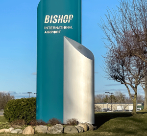 While major hub airports often dominate the spotlight, it’s regional airports like Flint Bishop International Airport (FNT) in southeast Michigan that are quietly redefining resilience and innovation. From pandemic-era pivots to international expansion goals, Sapone shares what it means to lead with purpose at a mid-sized airport, and why being small might just be Flint’s greatest strength. “It takes partnership with the community and regional partners to really make the airport thrive.” That is the philosophy that guides Nino Sapone as he leads Flint Bishop through a critical growth period. “Even though an airport like Flint has been there for a long time,” Sapone stated, “people really didn’t realise the service was there as we’re overshadowed by some bigger airports, like Detroit Metro. So, it’s like a hidden jewel.” Terminal transformation: rooted in local identity A key project in 2025 is the complete overhaul of Flint Bishop’s terminal, supported by a nearly $2 million FAA grant. “Most of that money is going toward the second phase of our airside terminal project,” Sapone explained. “It’s going to have all new ticketing counters and an all-new building.” But this isn’t just about bricks and mortar. “For the first time, we’re going to put in terrazzo flooring in Flint, and it’s going to be focused on the Flint demographics,” he added. “Downtown Flint’s famous buildings will literally be embedded in the floor. We want it to be a sense of place for the community.” Passenger experience and digital upgrades The passenger experience is getting a tech boost, too. “We’re redoing all our flight information display systems,” said Sapone. “There’ll be large, new monitors and an interactive screen at the entrance — you can ask questions, and it’ll react with you. That’s going to make the customer experience a lot better.” Outdated internal systems are also being overhauled to support more efficient operations — and more revenue. “There’s so much more opportunity for marketing, branding, advertising,” he noted. “We’ll be able to get revenue from brands marketing on our own equipment.” Open to innovation, always Sapone is keen to position Flint as a testing ground for new ideas. “Throughout my career, I’ve always partnered with innovation companies,” he said. “During the pandemic, we partnered with an Italian company, they brought in helmets with GPS and temperature reading. Our officers could look at you and read your temperature. Taking temperatures was the biggest thing back then.” Now, the airport regularly works with consultants and tech firms to trial emerging systems. “We’re open for business as a test bed,” he emphasised. Sustainability at the core Sustainability is built into every major capital project at Flint. “We’re changing all our lights to LED,” said Sapone. “We just built a new fire station with a federal grant — over $10 million — and a lot of sustainability features were part of the design.” Natural heating is also part of the strategy. “We added a lot of glass to bring heat into the terminal,” he said. “That really helps reduce the load on our HVAC systems.” Big ambitions, international reach One of Sapone’s top ambitions? Establishing an international service. However, smaller airports face hurdles in accessing Customs and Border Protection (CBP) resources. “We want to build an international terminal and start international traffic,” he said. “But we can’t get the co-operation from CBP. They don’t have the resources, and they can’t allocate staff to our facility.” Sapone hopes a new administration in Homeland Security will bring change. “We’re competing with CBP resources going to the borders. That takes away from airports like ours. We’re working with them and hoping we can make it work.” 2025 challenges and opportunities Looking ahead, Sapone is realistic about the pressures facing commercial aviation. “Airlines have a lot of constraints, such as capacity, pilot shortages, staffing,” he said. “And the biggest thing is Boeing. One airline we deal with was supposed to get eight or nine Boeing aircraft by the end of 2024. They only got one.” But there’s also reason for optimism. “There’s a mega site — a thousand acres, the biggest in the country — right next to the airport, slated for chip manufacturing. That’s going to bring a thousand jobs. Being the hometown airport for that business community is going to be big.” Punching above its weight At Flint Bishop International, challenge is the mother of creativity. From community-integrated design to smart digital upgrades and innovation, the airport is proving that scale is no barrier to leadership. Sapone sums it up best: “It takes partnerships to thrive. We might be small, but we’re open — and we’re ready.” About the interviewee Nino Sapone graduated from California University of Pennsylvania with a Bachelor of Science Degree in Education. He is an accredited airport executive and Chief Executive Officer of Flint Bishop International Airport. Prior to coming to Flint Bishop International Airport, he worked for 26 years at Pittsburgh International Airport. He is an Accredited Airport Executive and former President of the Northeast Chapter of the American Association of Airport Executives. Nino recently served on the AAAE Board of Directors, and serves on the Academic Relations, Operations, Safety and Emergency Planning, and Unmanned Aerial Systems committees. Nino is results driven, qualified airport and business operations professional who productively leads diverse teams to new levels of success in a variety of complex situations and fast-paced environments. Nino has strong technical and business qualifications with an impressive record of more than 30 years of firsthand and progressive experience. He possesses the proven ability to analyse organisational changing business needs; implement systems engineering strategies; identify deficiencies and potential opportunities; and develop innovative and cost-effective solutions for enhancing competitiveness, all while increasing revenues and improving customer service.